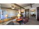 Comfortable living room with exposed beams and a view into kitchen at 622 N Dequincy St, Indianapolis, IN 46201