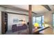 Bright living room with exposed beams, built-in shelving, and comfortable seating at 622 N Dequincy St, Indianapolis, IN 46201