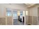 Open living room with classic details, fireplace, and view to dining area at 622 N Dequincy St, Indianapolis, IN 46201