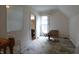 Attic space with natural light, showing potential for storage or conversion into a functional living area at 633 N East St, Greenfield, IN 46140