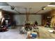 Spacious two-car garage showcasing ample storage with two garage doors and overhead lighting at 633 N East St, Greenfield, IN 46140
