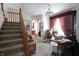 Spacious living room with carpeted stairs leading to the upper level at 633 N East St, Greenfield, IN 46140