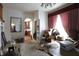 View of the living room featuring arched doorways and natural light at 633 N East St, Greenfield, IN 46140