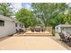 Wooden deck and a spacious patio provides ample outdoor living and entertainment space in this landscaped backyard at 6429 Walnut Way, Brownsburg, IN 46112