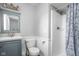 Well-lit bathroom features a shower and stylish vanity with a beautiful decorative mirror and lighting fixture at 6429 Walnut Way, Brownsburg, IN 46112