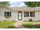 Charming home featuring a well-maintained front yard, decorative shutters, and an inviting entryway at 6429 Walnut Way, Brownsburg, IN 46112
