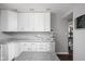 Modern kitchen with white cabinets, granite countertops, and stylish decorations create a welcoming culinary space at 6429 Walnut Way, Brownsburg, IN 46112