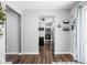 Open concept kitchen with stainless steel appliances and stylish decor flowing from adjacent living area at 6429 Walnut Way, Brownsburg, IN 46112