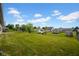 Lush green backyard with a well-maintained lawn and mature trees, providing an ideal space for recreation at 652 White Ash Trl, Mooresville, IN 46158