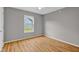 A simply designed bedroom with hardwood floors and a window that fills the space with natural light at 652 White Ash Trl, Mooresville, IN 46158
