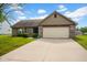 A well maintained home with attached two-car garage and a long driveway at 652 White Ash Trl, Mooresville, IN 46158