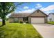 Charming single-story home with brick accents, well-manicured lawn, and attached two-car garage at 652 White Ash Trl, Mooresville, IN 46158