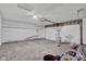 This garage features a pegboard wall and a white ceiling with lighting, offering ample storage and workspace at 652 White Ash Trl, Mooresville, IN 46158