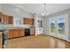 Bright kitchen with wood cabinets, granite counters, stainless appliances and access to backyard at 652 White Ash Trl, Mooresville, IN 46158