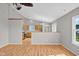 Bright, open-concept with vaulted ceiling living room leading into the kitchen with hardwood floors at 652 White Ash Trl, Mooresville, IN 46158