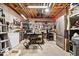 Large basement workshop with pegboard, workbench, refrigerator, and tools ready for any project at 7250 Royal Oakland Dr, Indianapolis, IN 46236