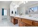 Spacious bathroom with a double vanity, large mirror, and plenty of natural light at 7250 Royal Oakland Dr, Indianapolis, IN 46236