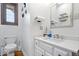 Charming powder room with a decorative mirror and a clean, modern aesthetic at 7250 Royal Oakland Dr, Indianapolis, IN 46236