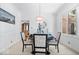Cozy dining room featuring a round table, stylish chairs, and large windows at 7250 Royal Oakland Dr, Indianapolis, IN 46236