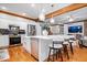 Spacious kitchen featuring a central island with modern lighting and stainless steel appliances at 7250 Royal Oakland Dr, Indianapolis, IN 46236