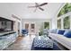 Comfortable living room with access to the deck via glass doors and windows that let in a lot of natural light at 7250 Royal Oakland Dr, Indianapolis, IN 46236