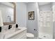 This bathroom features a white vanity with a marble countertop and an enclosed shower stall at 734 Summitcrest Dr, Indianapolis, IN 46241