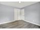 This bedroom offers neutral walls, gray flooring, and a closet with double doors at 734 Summitcrest Dr, Indianapolis, IN 46241