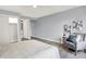 Bright bedroom with a closet, chair, side tables, and a view of the ensuite bathroom at 734 Summitcrest Dr, Indianapolis, IN 46241