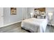 The main bedroom features laminate floors, and contemporary décor, providing a relaxing retreat at 734 Summitcrest Dr, Indianapolis, IN 46241