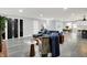 A expansive living area showcases contemporary design, a fireplace and seamless flow into the kitchen at 734 Summitcrest Dr, Indianapolis, IN 46241