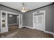 Spacious living room with hardwood floors and an open layout leading to the kitchen at 761 N Holmes Ave, Indianapolis, IN 46222