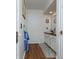 Neutral bathroom showcases a single sink vanity, granite countertop, white cabinets, and neutral flooring at 7612 Farm View E Cir, Indianapolis, IN 46256