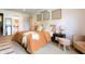 Bedroom featuring a queen-sized bed with wooden headboard, sitting chair, and plush decor at 7612 Farm View E Cir, Indianapolis, IN 46256