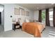 Bright bedroom with a queen size bed with wood accents, soft pillows, and a cozy chair at 7612 Farm View E Cir, Indianapolis, IN 46256