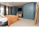 Primary bedroom features a queen bed, custom built in shelving and storage, and neutral decor at 7612 Farm View E Cir, Indianapolis, IN 46256