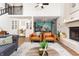 Open living space with fireplace, high ceilings, and views into the dining area at 7612 Farm View E Cir, Indianapolis, IN 46256