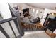 Bright and airy living room viewed from above, features neutral tones, a fireplace, and hardwood floors at 7612 Farm View E Cir, Indianapolis, IN 46256