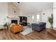 Bright living room with hardwood floors, fireplace and a comfortable seating area at 7612 Farm View E Cir, Indianapolis, IN 46256
