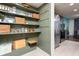 Pantry with stainless steel fridge and an open view of the kitchen and dining area at 7612 Farm View E Cir, Indianapolis, IN 46256