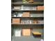 Well-organized pantry with wicker baskets, glass jars, and shelves for ample storage at 7612 Farm View E Cir, Indianapolis, IN 46256