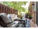 Cozy outdoor patio with comfortable seating, stylish rug, and privacy fence at 7612 Farm View E Cir, Indianapolis, IN 46256