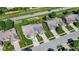 This aerial shot features a well-kept property with a green lawn, a driveway for two cars, and lush landscaping at 785 Cottage Ln, Greenwood, IN 46143
