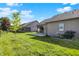 Landscaping adds beauty to this backyard with lawn and privacy fence at 785 Cottage Ln, Greenwood, IN 46143