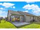 An expansive green backyard with a concrete patio and slider enhance the home's appeal at 785 Cottage Ln, Greenwood, IN 46143