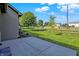 A concrete patio with fenced yard and trees creates an inviting outdoor space at 785 Cottage Ln, Greenwood, IN 46143