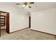 Bedroom with neutral carpet, vaulted ceiling, fan, and closet with shelves at 785 Cottage Ln, Greenwood, IN 46143