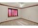This bedroom is brightly lit with a decorative accent wall and a large window at 785 Cottage Ln, Greenwood, IN 46143