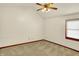 Bedroom with neutral carpet, vaulted ceiling, fan, and a window for plenty of natural light at 785 Cottage Ln, Greenwood, IN 46143