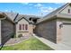 Charming home with brick accents, manicured lawn, and a pathway leading to the welcoming front entrance at 785 Cottage Ln, Greenwood, IN 46143