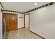 Hallway with wood trim, tile flooring, and a closet, leading to the rest of the house at 785 Cottage Ln, Greenwood, IN 46143